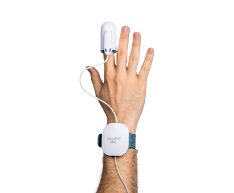 Hand wearing a WatchPAT ONE device for sleep apnea monitoring.