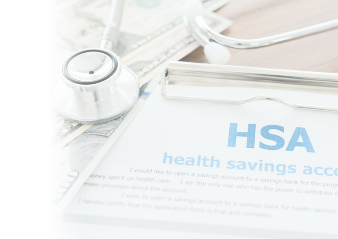 HSA document on clipboard with stethoscope and dollar bills indicating health savings account concept.